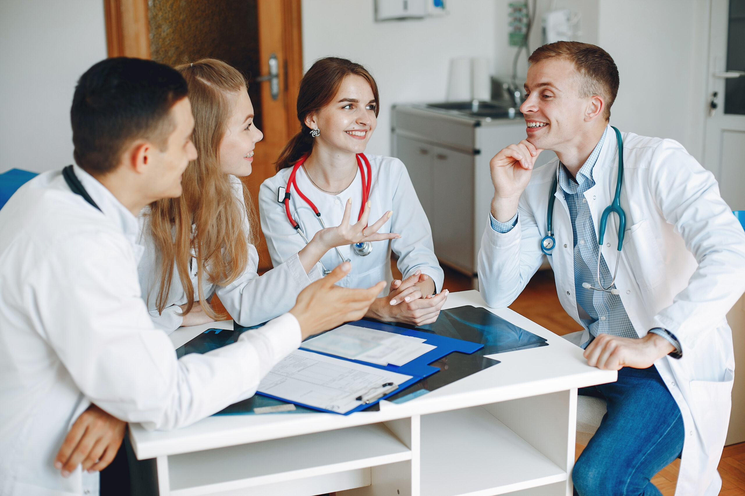 four medical officers are having conversation